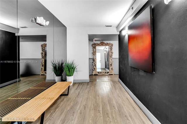 1512 Washington Ave Unit 106, Miami Beach, FL 33139 - hallway with baseboards and wood finished floors