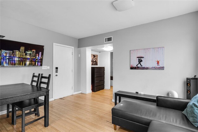 1512 Washington Ave Unit 203, Miami Beach, FL 33139 - living area with light wood-style flooring and baseboards