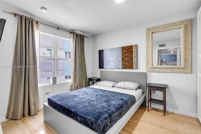 bedroom with wood-type flooring