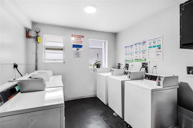 clothes washing area featuring separate washer and dryer