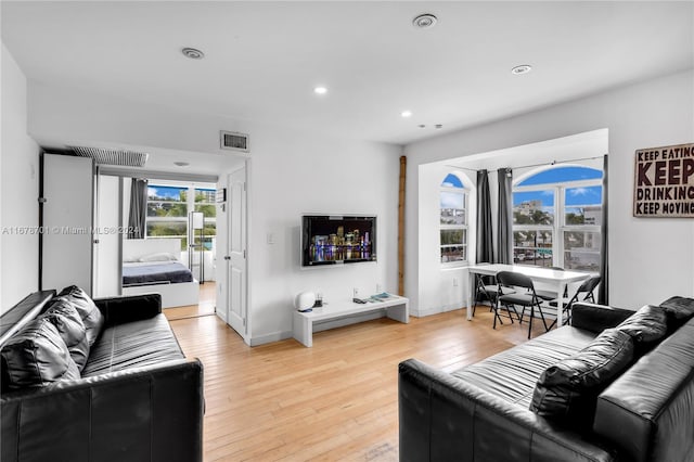 living room with light hardwood / wood-style floors