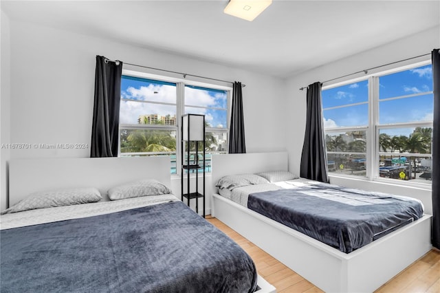 bedroom with hardwood / wood-style floors