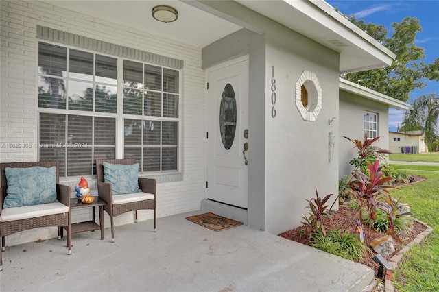 property entrance featuring covered porch