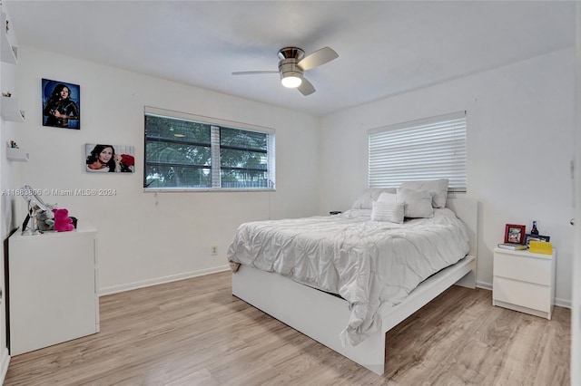 bedroom featuring ceiling fan and light hardwood / wood-style flooring