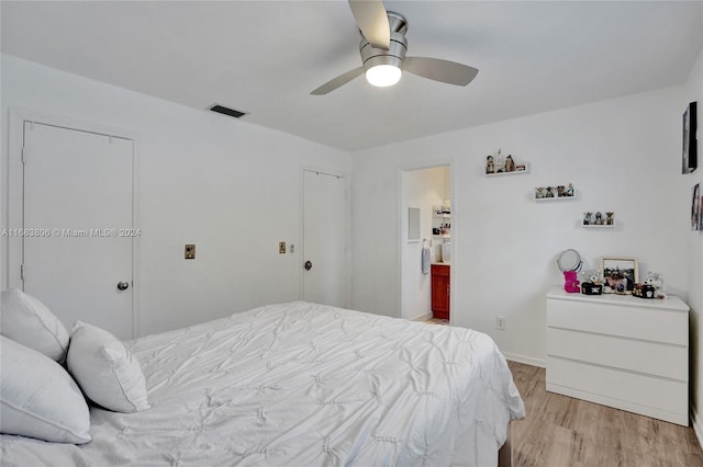 bedroom with light hardwood / wood-style floors and ceiling fan