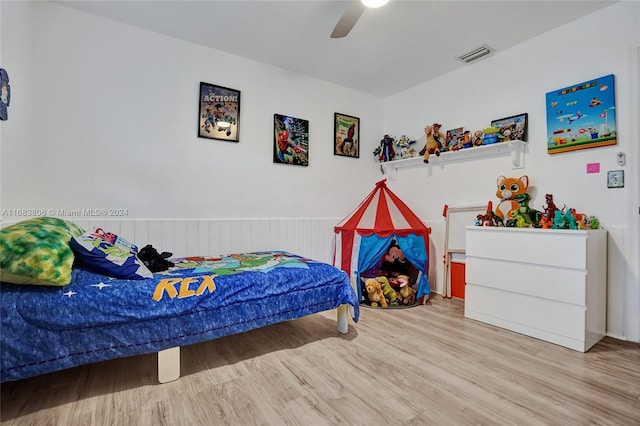 bedroom with light wood-type flooring and ceiling fan