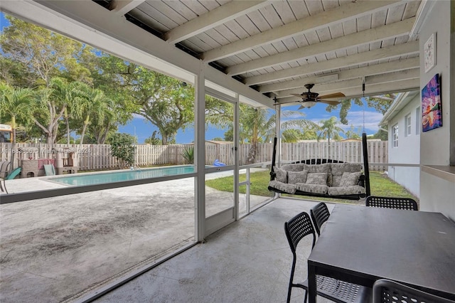 view of patio with ceiling fan and a fenced in pool