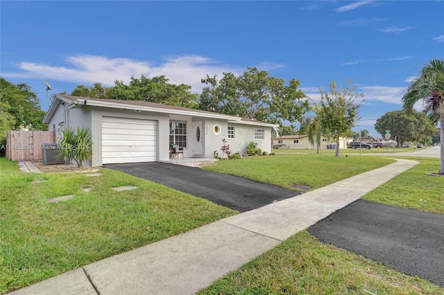 single story home with a garage, central AC unit, and a front lawn