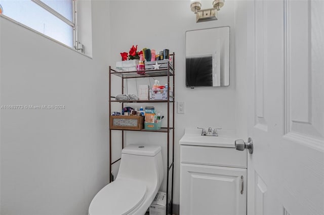 bathroom featuring vanity and toilet