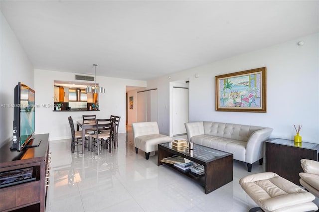 living room with light tile patterned flooring