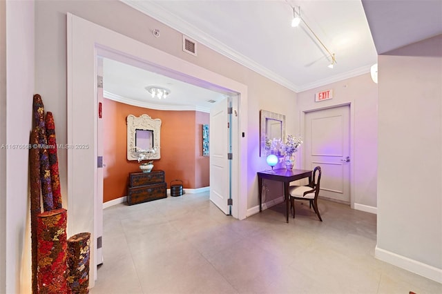 corridor with rail lighting and ornamental molding