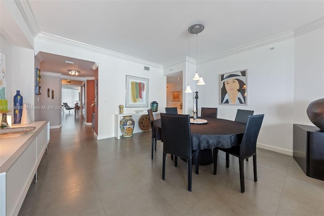 dining area featuring ornamental molding