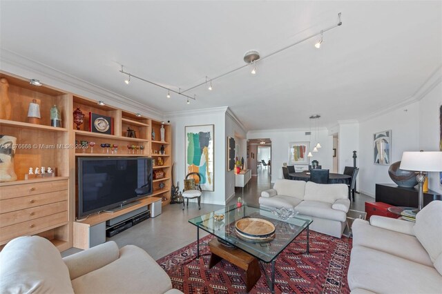 living room with crown molding and concrete flooring