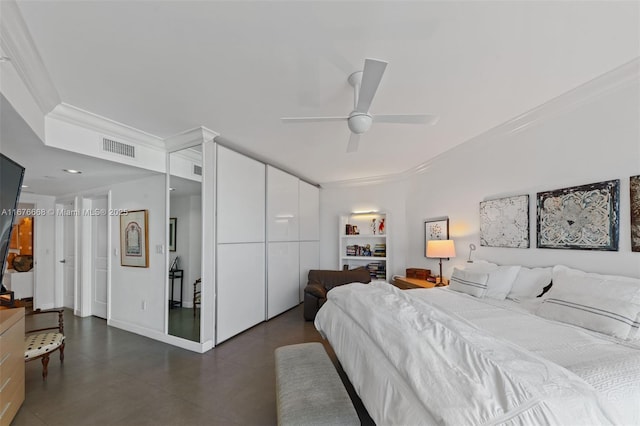 bedroom featuring ceiling fan, ornamental molding, and a closet