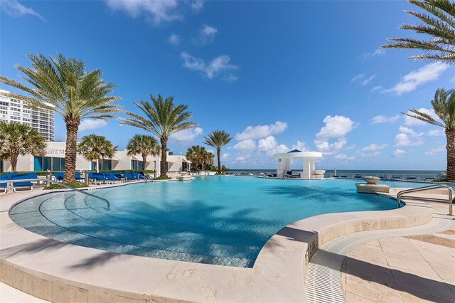 view of pool featuring a water view