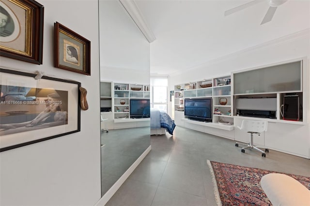 interior space featuring ceiling fan and crown molding