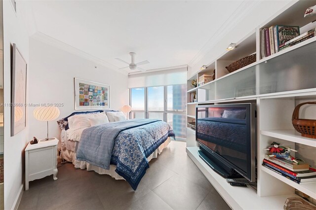 bedroom featuring ceiling fan and crown molding