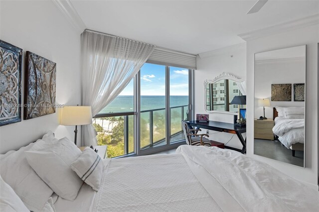 bedroom with ornamental molding, a wall of windows, and a water view