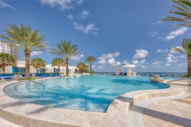 view of pool with a water view