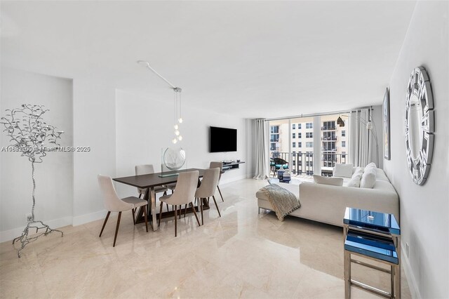 living room featuring floor to ceiling windows