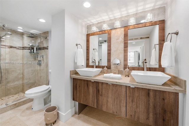 bathroom with vanity, an enclosed shower, and toilet