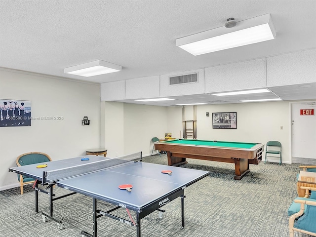 playroom featuring carpet flooring and a textured ceiling