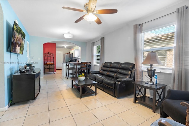 living room featuring light tile patterned flooring and ceiling fan