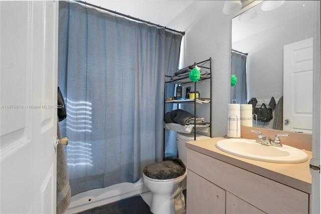 full bathroom with vanity, toilet, and shower / bathtub combination with curtain