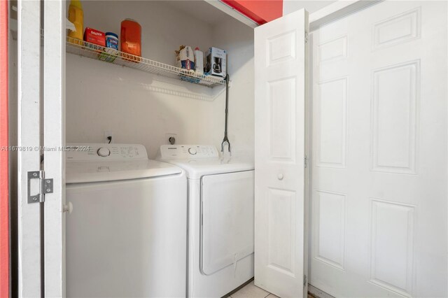 laundry area with independent washer and dryer