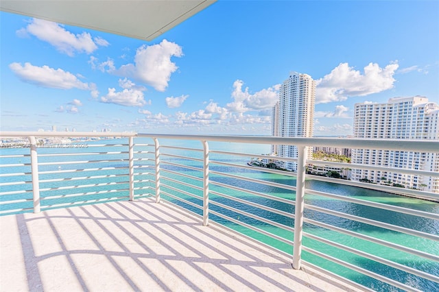 balcony featuring a water view