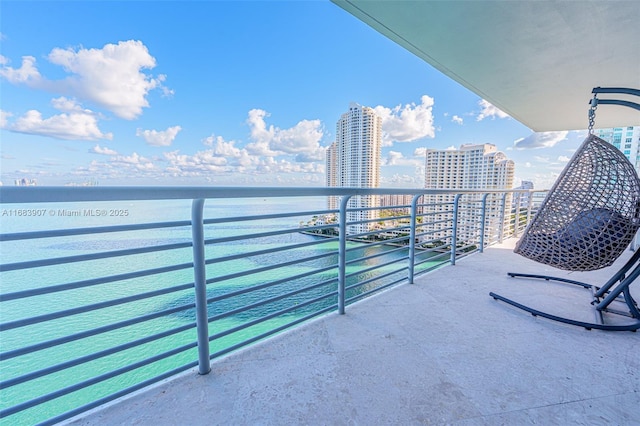 balcony featuring a water view