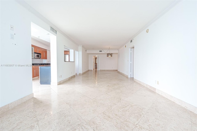 unfurnished room with crown molding and a notable chandelier