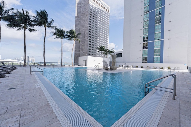 view of swimming pool with a patio