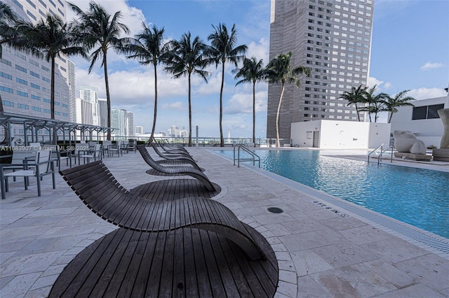 view of pool featuring a patio