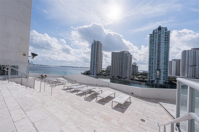 view of patio featuring a water view