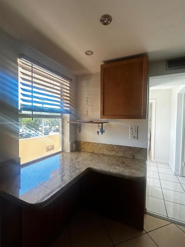 kitchen with light tile patterned floors