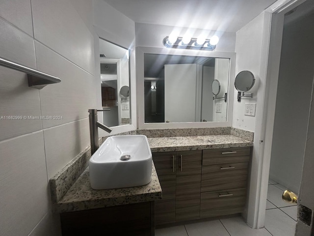 bathroom featuring tile patterned floors and vanity