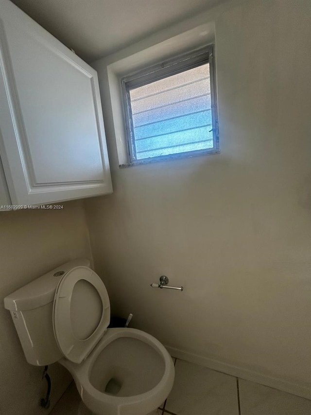 bathroom featuring toilet and tile patterned floors