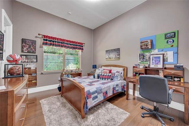 bedroom with wood-type flooring