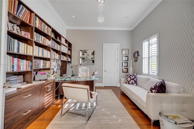 office space with crown molding and light wood-type flooring