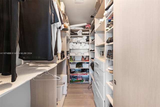 spacious closet featuring light hardwood / wood-style floors