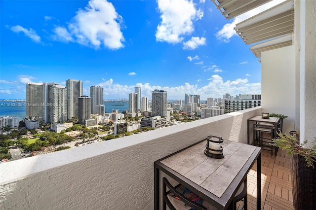 balcony featuring a water view