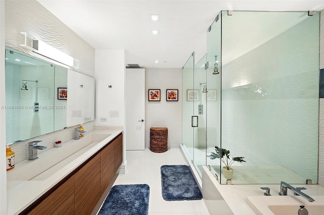 bathroom featuring vanity, tile patterned floors, and separate shower and tub