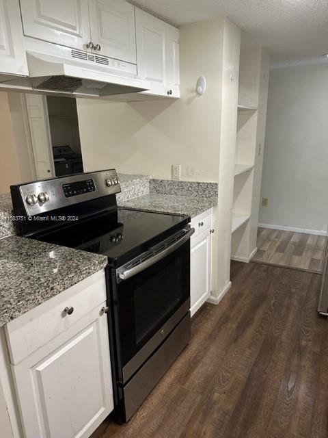 kitchen featuring white cabinetry, electric range, and dark hardwood / wood-style flooring