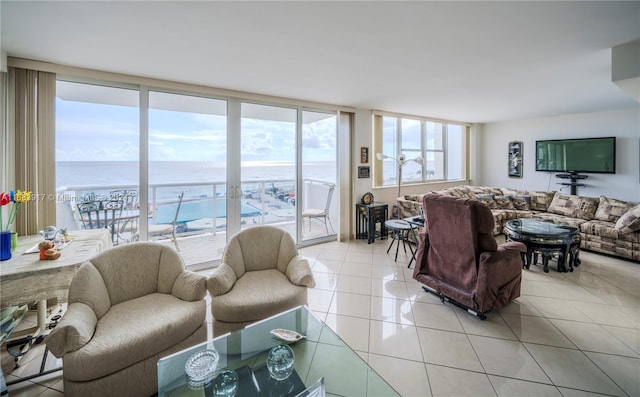 tiled living room with a water view