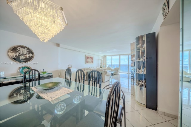 tiled dining area with a healthy amount of sunlight and floor to ceiling windows