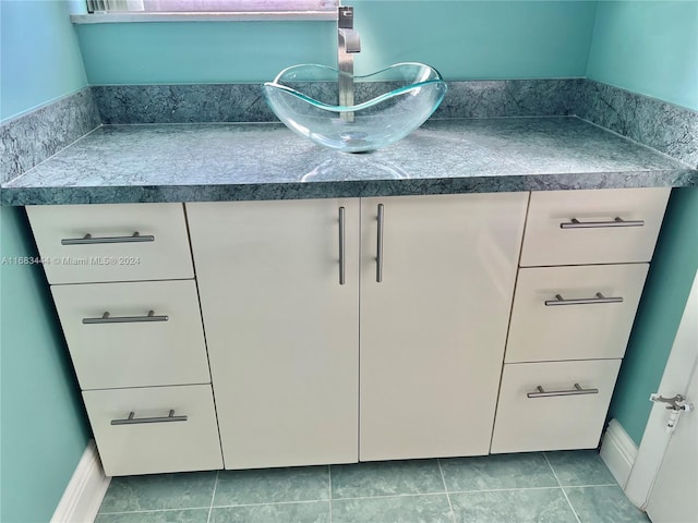 interior space featuring vanity and tile patterned floors