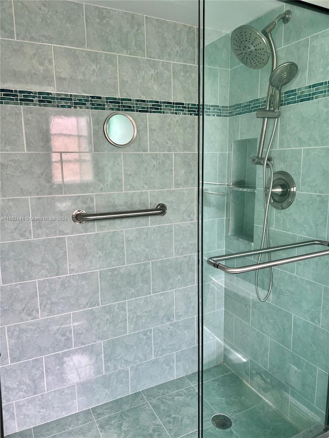 bathroom with tiled shower