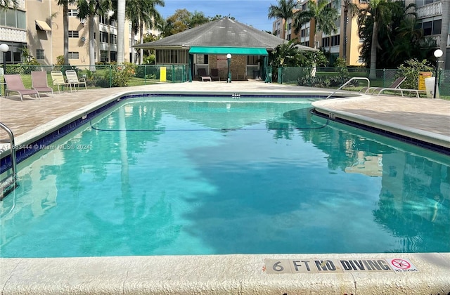 view of pool featuring a patio