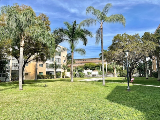 view of property's community featuring a yard